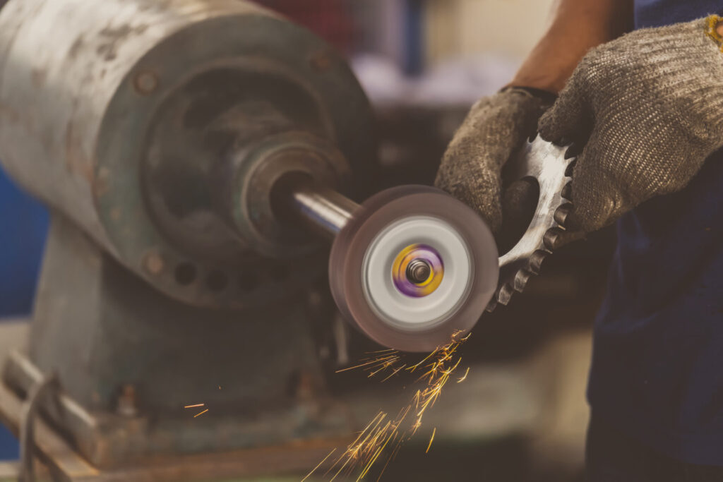 closeup angle grinder hand holding and grinding th 2024 02 23 05 03 55 utc